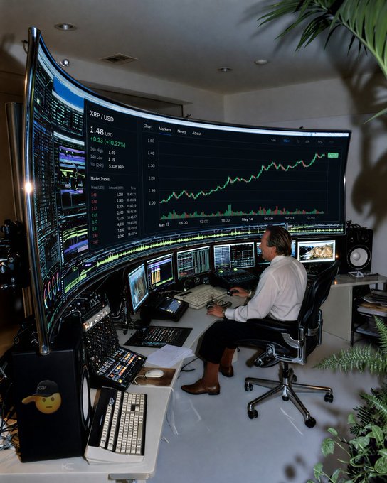 A trader sits at a desk surrounded by multiple curved monitors displaying XRP/USD at 1.48 (up 10.22%) with a candlestick chart and market trades data, humorously fulfilling the caption's joke about monitoring XRP's price in HD by showcasing an elaborate multi-screen trading setup.