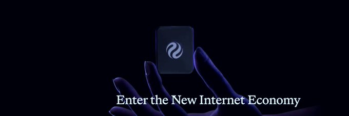 A dark promotional image showing a hand holding a small device with a wave symbol, accompanied by the text 'Enter the New Internet Economy.'