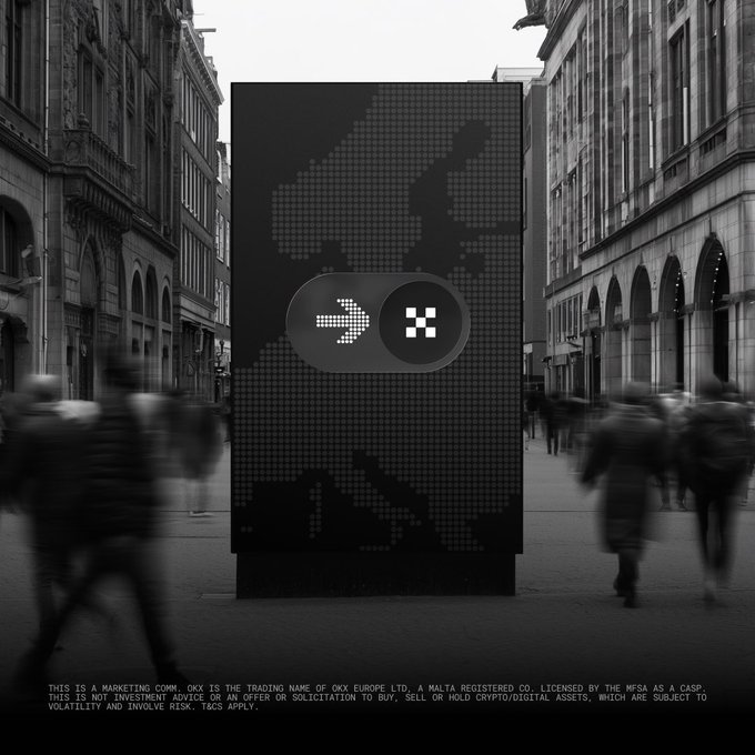 A large billboard featuring the OKX logo stands in a busy European city street with motion-blurred pedestrians, reinforcing the message that OKX is a MiCA-authorized, regulated crypto platform for safely moving digital assets. The fine print at the bottom notes: "THIS IS A MARKETING COMM. OKX IS THE TRADING NAME OF OKX EUROPE LTD. A MALTA REGISTERED CO. LICENSED BY THE MFSA AS A CASP. THIS IS NOT INVESTMENT ADVICE OR AN OFFER OR SOLICITATION TO BUY, SELL OR HOLD CRYPTO/DIGITAL ASSETS, WHICH ARE SUBJECT TO VOLATILITY AND INVOLVE RISK. T&CS APPLY."