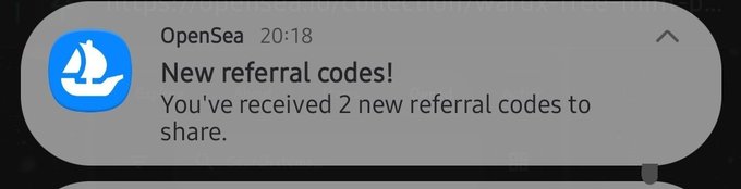A notification from the OpenSea app reading 'New referral codes! You've received 2 new referral codes to share.'