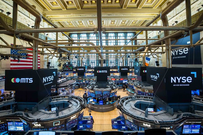 The New York Stock Exchange trading floor appears empty and calm, with large displays showing "NYSE" and "MTS" branding under the soaring, ornate ceiling of the iconic hall. The quiet, closed-floor scene visually echoes the post's reflective pause, suggesting a moment of gratitude and optimism before "only getting better from here" as markets reopen.