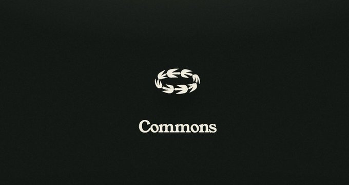 A minimalist black screen displaying the 'Commons' logo with a wreath of bird/leaf symbols in white.