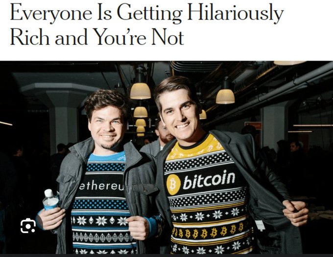A satirical article headline 'Everyone Is Getting Hilariously Rich and You're Not' above a photo of two men wearing Christmas sweaters featuring Bitcoin and Ethereum logos.