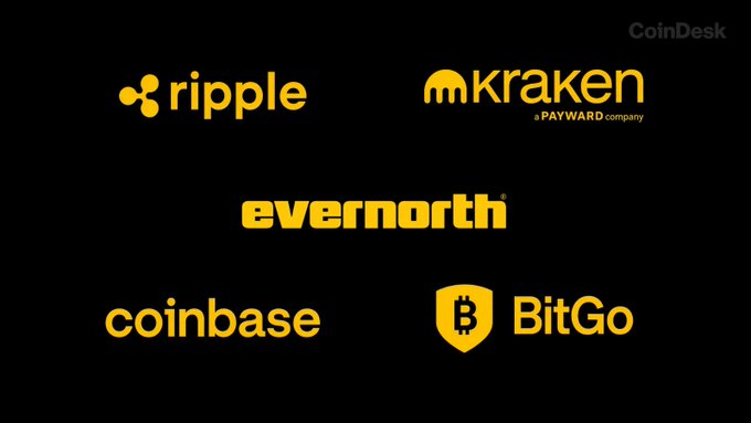 A black screen with yellow logos displays cryptocurrency and financial companies: 'ripple', 'kraken a PAYWARD company', 'evernorth', 'coinbase', and 'BitGo', with 'CoinDesk' watermark in the corner.