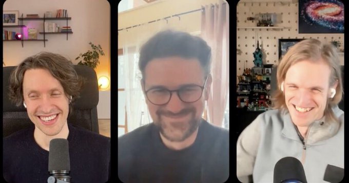A three-panel video call screenshot featuring three men laughing, with microphones visible in the foreground.