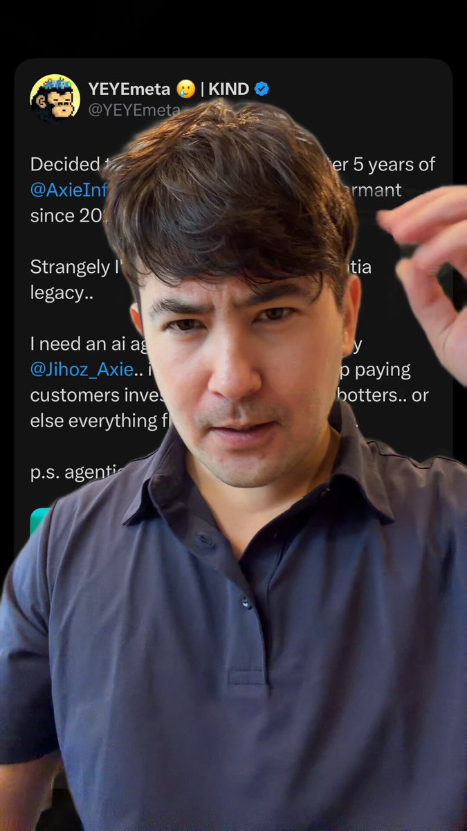 The image features a man wearing a blue shirt, with his hand raised as if he's about to make a gesture or point at something. The background of the image is black, which contrasts with the man's blue shirt. There are also some words written in the image that seem to be part of a post on social media.