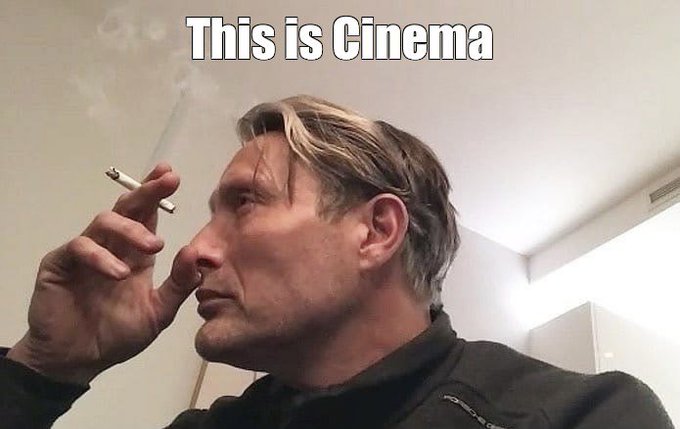 A man smoking a cigarette with a contemplative expression, overlaid with the text 'This is Cinema' in classic meme format.