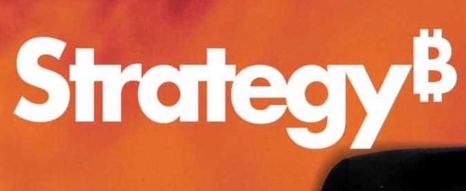 The image shows an orange banner with white text that reads "Strategy B". The text is positioned at the top left corner, while the rest of the banner occupies the bottom right area. Below this, there are two lines of text written in a smaller font size and color. One line reads "Long-term accumulation remains the objective." Another line states "The signal has been received. Still adding dots." The image seems to be related to Bitcoin or cryptocurrency, as it is described as an advertisement for Bitcoin.