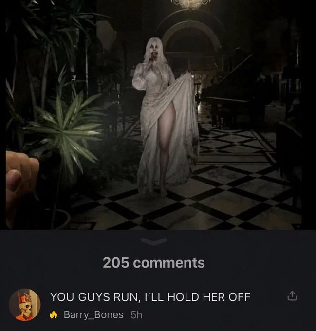A screenshot of a social media post shows a pale, ghostly woman in a flowing white dress in a dark grand hall, with the post displaying "205 comments" and a top comment from user "Barry_Bones" that reads "YOU GUYS RUN, I'LL HOLD HER OFF."