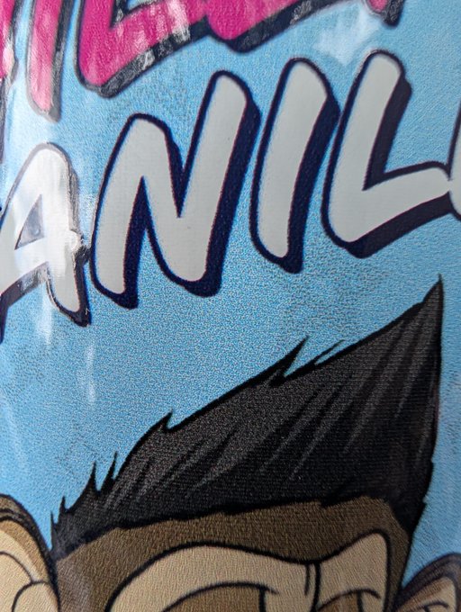 The image features a close-up of a blue can with a cartoon depiction of an animated character, likely a monkey or a bear, wearing a hat and holding a book. The background appears to be a light brown color, possibly representing a tree trunk. The text "bored ape yacht club" is written in the bottom right corner of the image. This post seems to be related to the cartoon character on the can as it promotes a book club for people who are bored and looking for something fun to read or do.