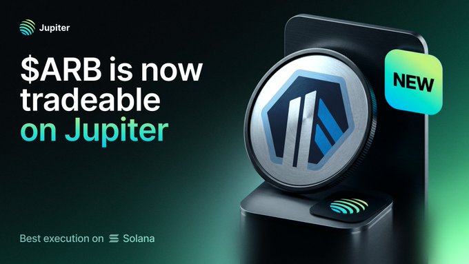 The image is a promotional graphic featuring a 3D render of a silver ARB (Arbitrum) coin displayed on a black stand with a glowing green "NEW" badge. The text reads "$ARB is now tradeable on Jupiter - Best execution on Solana," directly supporting the announcement that Arbitrum's $ARB token is now live for trading on the Jupiter platform.