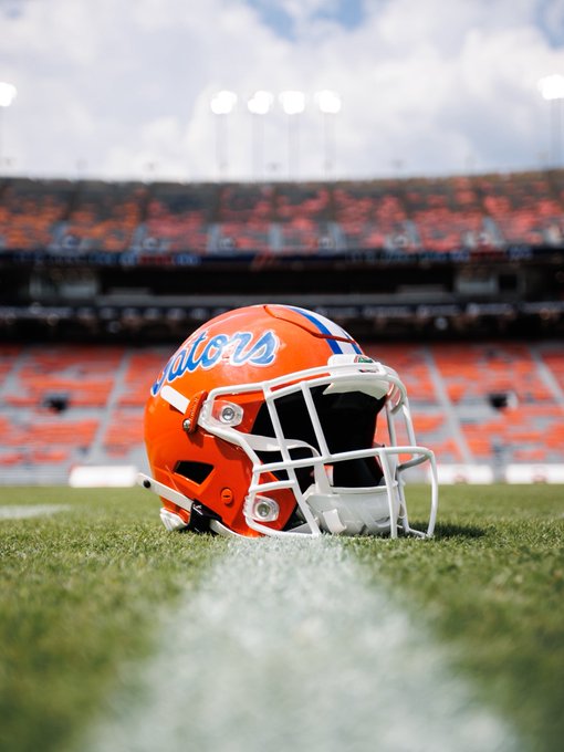 A Florida Gators football helmet sits on the field at a stadium, with "Gators" displayed on its side. The image aligns with the post's metaphorical question about whether the team can succeed "without XRP on the field," suggesting the team is missing a key player or element needed to win.