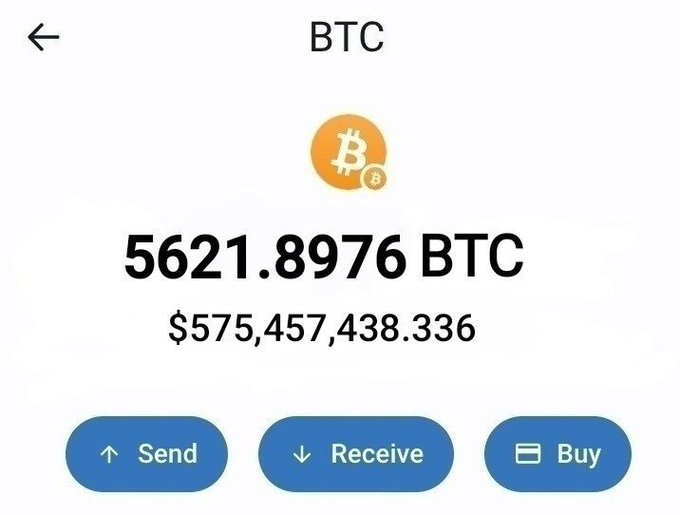 A cryptocurrency wallet app screenshot showing a Bitcoin (BTC) balance of 5621.8976 BTC, valued at $575,457,438.336, with Send, Receive, and Buy options.