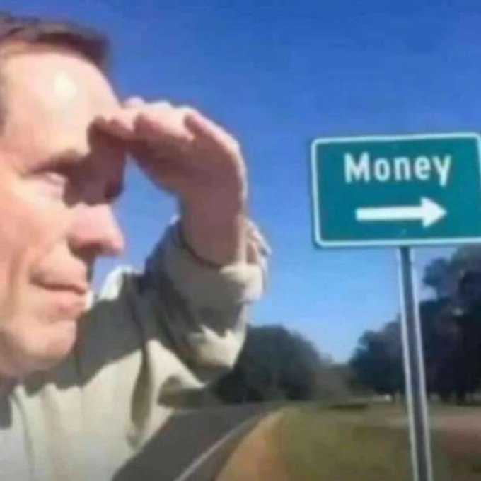 A man squints into the distance while shielding his eyes from the sun, spotting a "Money →" road sign ahead on a sunny highway.

The post congratulates giveaway winners, and the image's "Money" sign visually represents the finding/claiming of cash rewards in the giveaway.