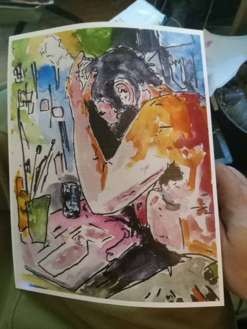 The image shows a vibrant watercolor and ink painting of a bearded man in an orange shirt sitting at a table, seemingly focused on drawing or working on artwork. A hand holds the painting against a background of papers, highlighting the loose, expressive style and bold color palette of greens, oranges, and pinks. The accompanying post about applying to SuperRare fits perfectly, as the artwork exemplifies the creator's proud, distinctive style deserving of broader exposure on a new platform.