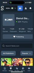 A screenshot of the Sora app showing a user profile for 'Donut Ga...' with 224 Following, 1.1K Games, 1.20K Followers, $1.20B Imported, and 111.23 Imported videos, marked as Following, with a search bar for 'Stickers.com' and popular stickers displayed at the bottom.