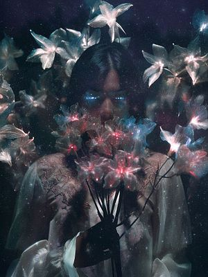 A surreal portrait of a person with glowing blue eyes surrounded by luminous, ethereal flowers against a dark background.