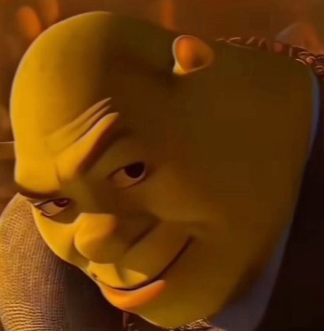 The image features Shrek wearing a sinister, knowing smirk, often used as a meme to convey smugness about outsmarting others. It relates to the post by humorously suggesting that those who were bearish on Coinbase ($COIN) at its bottom were completely wrong, much like underestimating Shrek.