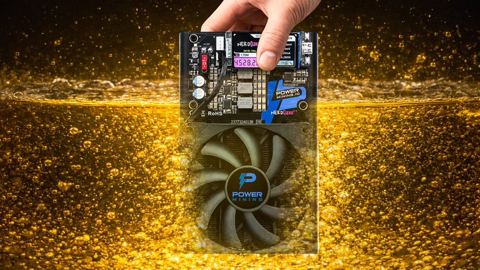 The image features a person's hand holding a small computer fan, with a gold background that includes bubbles floating around it. The caption of the image reads "New Video is LIVE! This NEW @PowerMiningFarm NerdQAxe++ Solo Bitcoin Miner is Insane! It wasn't MEANT for this ... but let'S do it anyways!".
