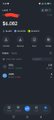 A dark mobile app interface shows a balance of $4.00 with various cryptocurrency icons and trading information visible.
