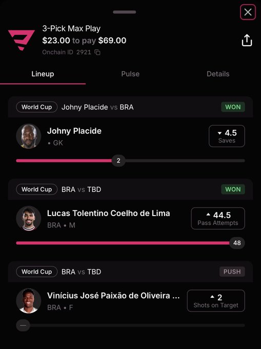 The image shows a cell phone screen displaying information from an app called "PicksdotApp". The main focus of this screen is a conversation between two people - one person is saying that Brazil achieved a 2nd win, while the other person counters by stating that Brazil had only a 3x on this particular match. A post on social media named @PicksdotApp mentions these two individuals and suggests tagging two friends for "Go" using the "SOLANA ADDRESS". The conversation appears to be about World Cup soccer match results, as well as a discussion of a person's account being sent $20 in USX currency.