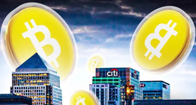 Two large Bitcoin logos float over a cityscape featuring a Citi bank building against a soft blue sky, visually representing Citi's announcement to launch a digital asset custody service beginning with Bitcoin.
