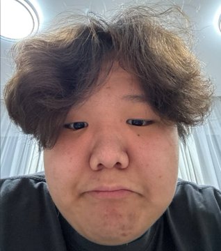 A close-up selfie of a young man with messy brown hair, appearing to be the rumored player "mzinho" in question. The intimate portrait style suggests a personal reaction or commentary on the BC Game signing rumor.