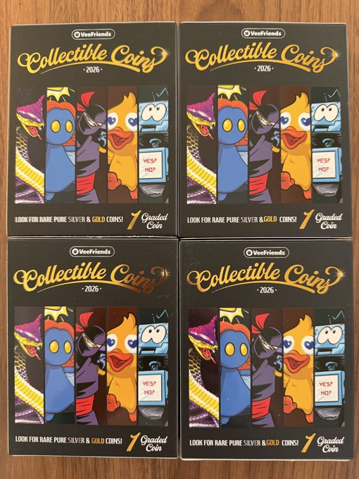 Four boxes of VeeFriends Collectible Coins (2026 edition) are arranged in a grid, each featuring cartoon characters and the text 'LOOK FOR RARE PURE SILVER & GOLD COINS!' and '1 Graded Coin'.