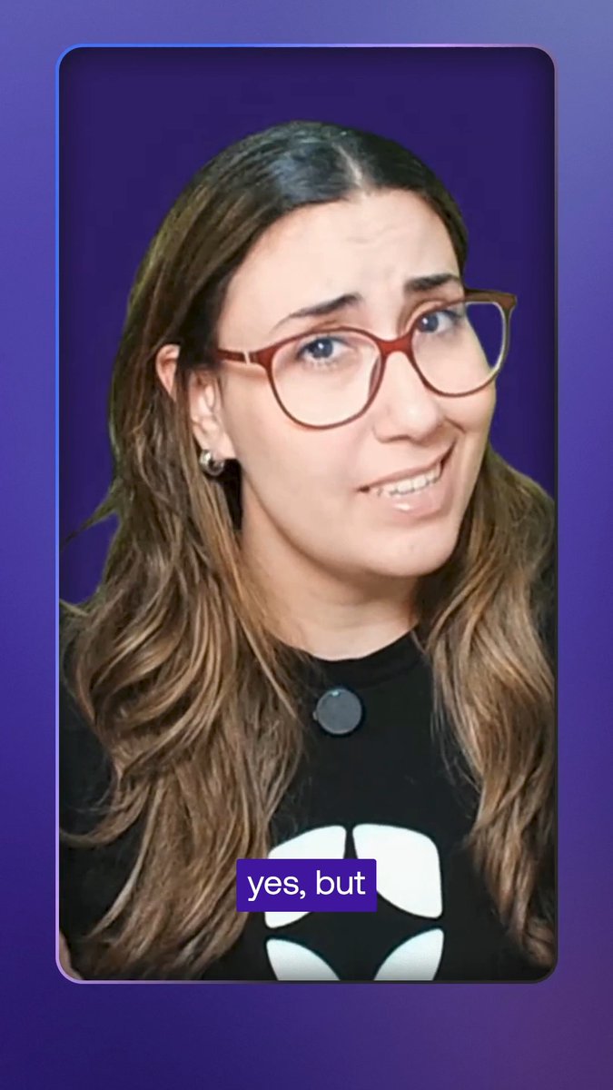 A woman wearing red-framed glasses and a black shirt with a circular pendant appears against a purple background with the caption "yes, but" displayed at the bottom.