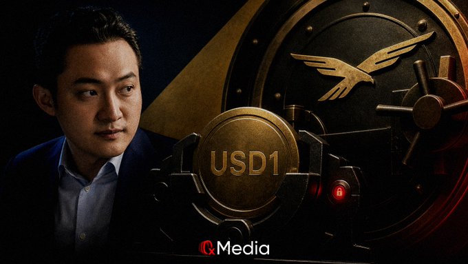 A composite image showing an Asian man in a suit alongside a large vault door featuring a bird emblem, with 'USD1' displayed on a golden coin and 'Q Media' logo at the bottom.