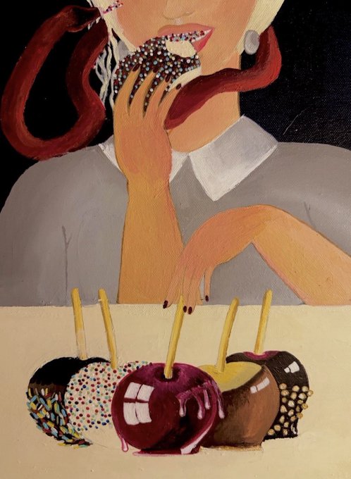 The image features a woman eating an apple with caramel, surrounded by other apples that are also covered in caramel. There are five caramel-covered apples in total, each one placed next to the woman who is enjoying her treat. The scene appears to be set on a dining table or countertop where these delicious desserts are displayed for consumption.