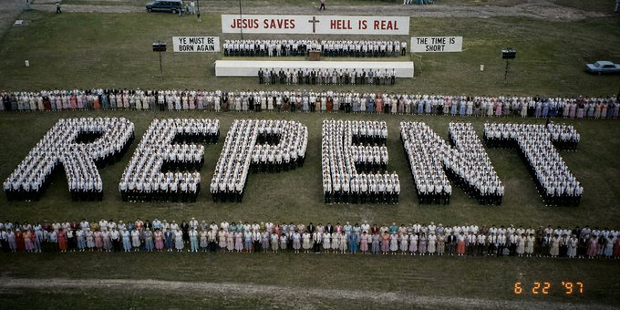 An aerial photograph dated '6 22 '97' shows a large group of people arranged to spell 'REPENT' on a field, with signs reading 'JESUS SAVES', 'HELL IS REAL', 'YE MUST BE BORN AGAIN', and 'THE TIME IS SHORT' displayed on a stage.