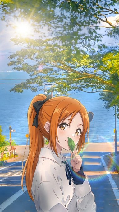 An anime illustration of an orange-haired girl with a black bow holding a green leaf near her face, set against a sunny seaside scene with trees, ocean, and a rainbow lens flare.