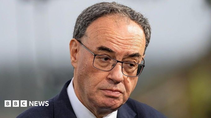 A close-up portrait of Andrew Bailey, the Governor of the Bank of England, looking serious in a suit and glasses, with the BBC News logo in the bottom left corner.