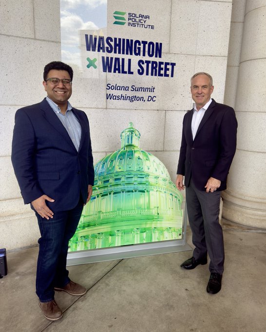Two men in business attire pose on either side of a large green-tinted display of the U.S. Capitol dome, with the event signage reading "Solana Policy Institute - Washington x Wall Street - Solana Summit, Washington, DC." The photo captures @pgpzcash and @zodl_co representing ZOLANA at the Solana Summit in Washington, D.C.