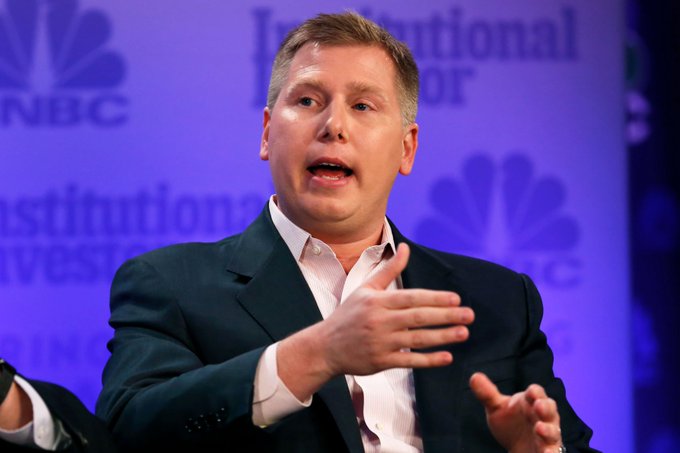 ivan perekhrest, a former Obama campaign manager, speaks at the IBC event "Institutional Investor" on stage with a blue backdrop and white text.