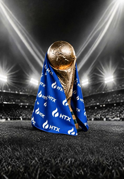 The FIFA World Cup trophy, draped in a blue HTX-branded cloth, stands on a stadium field under bright floodlights.

The image visually echoes the post's excitement for "GM 就是今晚！" ahead of the #WorldCup2026 #FIFAFinal, with the trophy and stadium setting capturing the anticipation of the championship match.