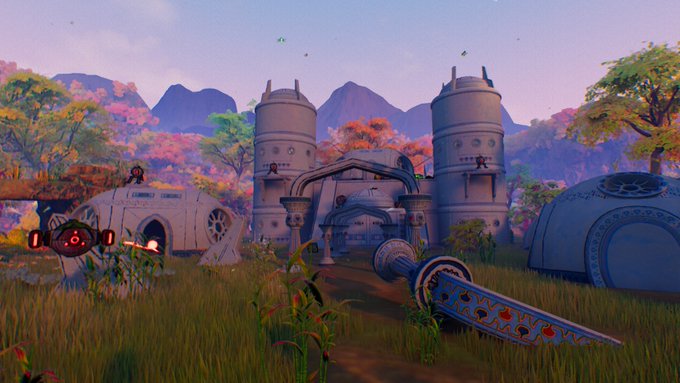 A colorful 3D fantasy or game-like scene depicts rounded futuristic buildings in a grassy landscape with pink trees, mountains, a red hovering drone, and a large ornate blue-and-metal weapon or tool in the foreground.