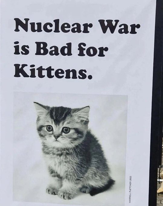A poster displays an adorable gray tabby kitten below bold text reading "Nuclear War is Bad for Kittens," with a small credit to Harriet Fletcher 2022, pairing a heartwarming image with a stark anti-war message—echoing the post's hopeful, community-driven vibe and $BNKR ticker.