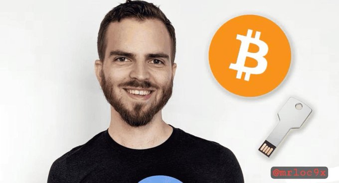 Man with a beard smiling next to Bitcoin logo and a hardware wallet key, watermarked '@mrloc9x'.