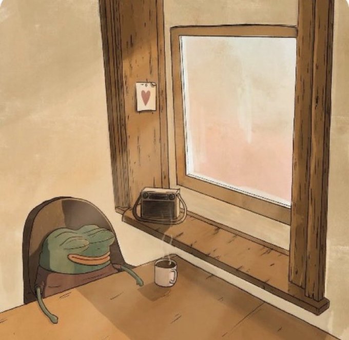 A warm-toned illustration showing a green frog-like character wearing a hat sitting at a wooden table with a steaming mug, looking out a window at a soft pink sky, with a small heart card on the wall and a radio on the windowsill.