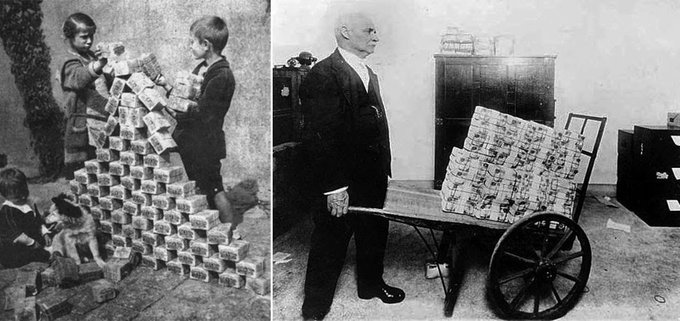 A black-and-white image showing children playing with towering stacks of bundled currency on the left, and a man beside a wheelbarrow loaded with similar bricks of paper money on the right—visually capturing the era of hyperinflation (likely Weimar Germany) when cash became so devalued it took wheelbarrows full of bills to buy basic goods.
