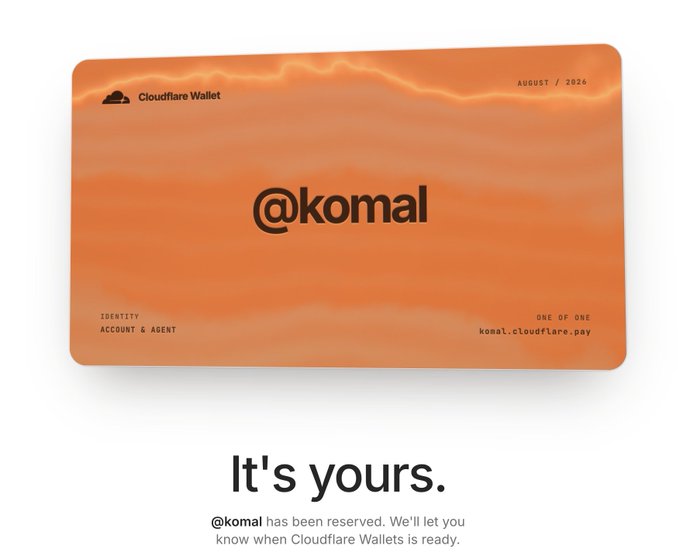 An orange Cloudflare Wallet card displayed with the handle '@komal' and the date 'AUGUST // 2026', accompanied by the text 'It's yours.' indicating the handle has been reserved.