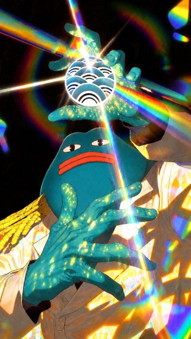 A surreal artistic image of a blue creature with large expressive eyes and red lips holding a patterned sphere, with rainbow-colored hands creating a prismatic light effect against a dark background.
