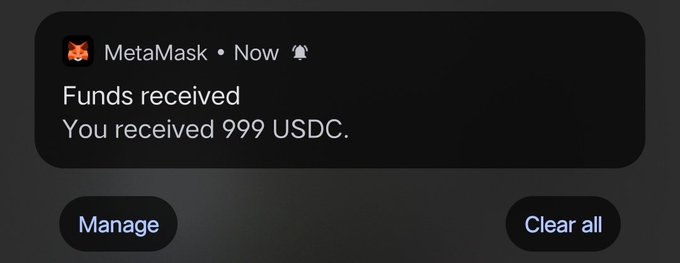 A MetaMask push notification on a mobile device stating 'Funds received - You received 999 USDC.'