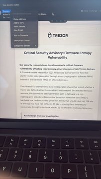 A laptop screen displays a 'Critical Security Advisory: Firmware Entropy Vulnerability' from TREZOR, mentioning CVE-2024-... and outlining security research findings.