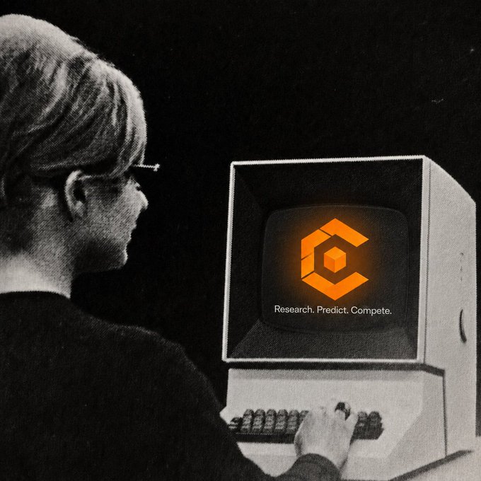 A black-and-white illustration of a person with glasses using a vintage computer that displays an orange 'C' logo and the text 'Research. Predict. Compete.'