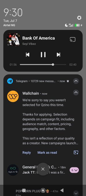 A smartphone lock screen at 9:30 on Tue, Jul 7, displaying a music player for "Bank Of America" by Seyi Vibez and a Telegram message from Wallchain saying the user wasn't selected for Qzino.