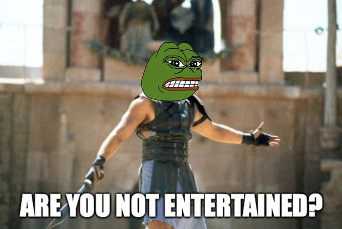 A meme featuring a character with a Pepe the Frog face edited onto their head, standing in a gladiator arena with the caption 'ARE YOU NOT ENTERTAINED?'.