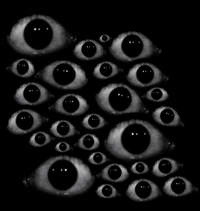 A black and white surreal artwork featuring many eyes of various sizes floating against a solid black background.